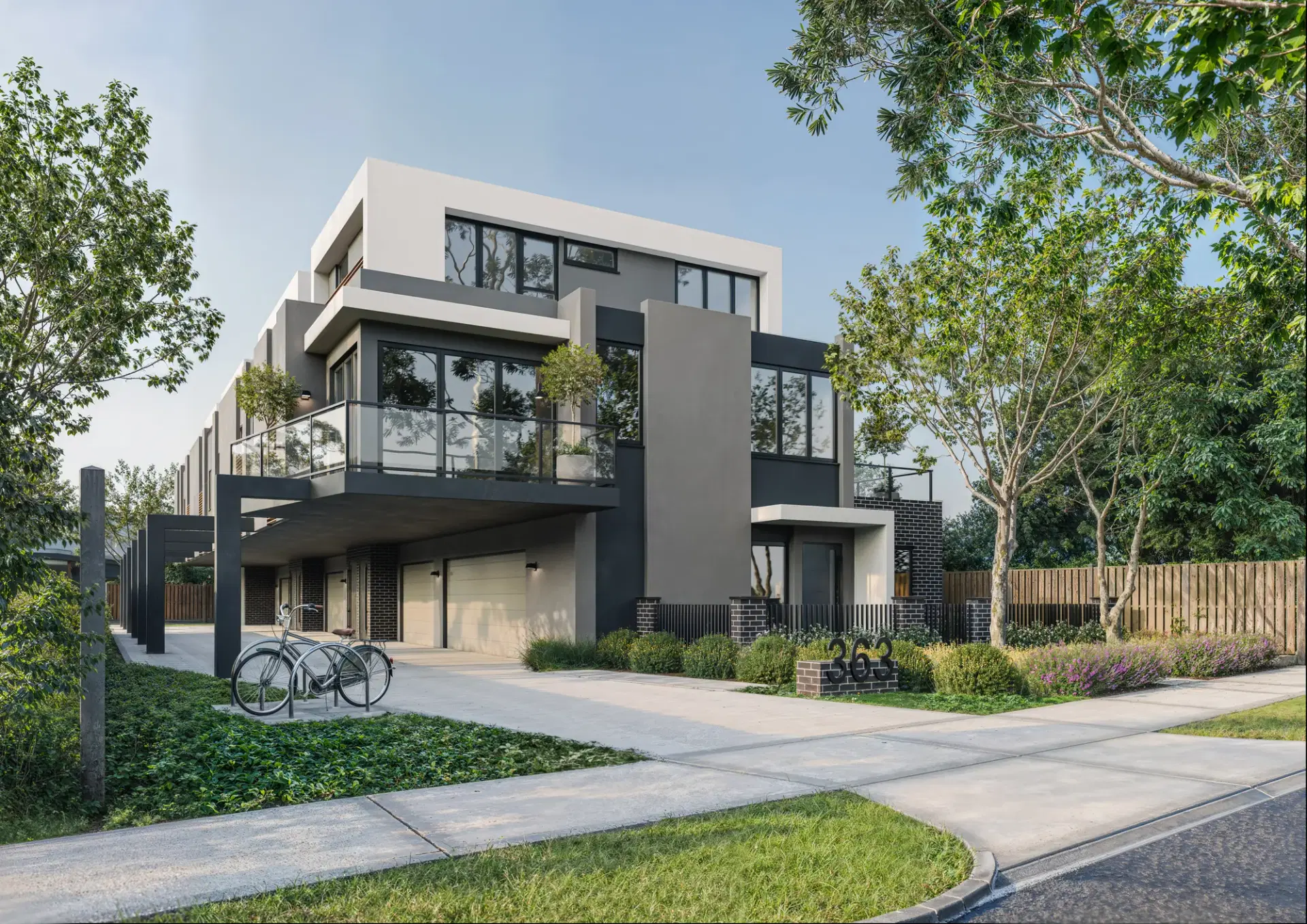Three-level residential building at 363 Waterdale Road, Bellfield, with rendered and dark brick forms above basement parking